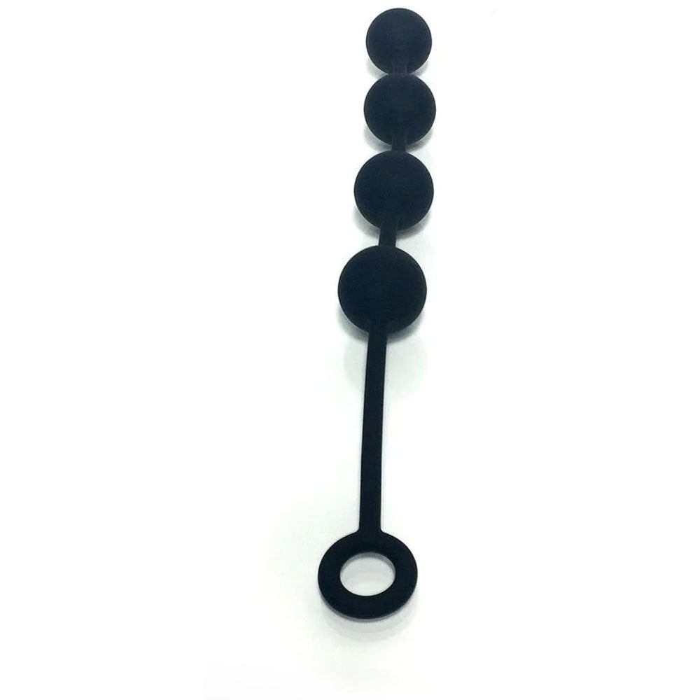 The Boneyard Ass Ballz M in Black are medium-sized anal balls made from soft-touch silicone, featuring five progressively larger beads on a flexible rod with a loop handle for easy control and grip. The hypoallergenic design is set against a plain white background.