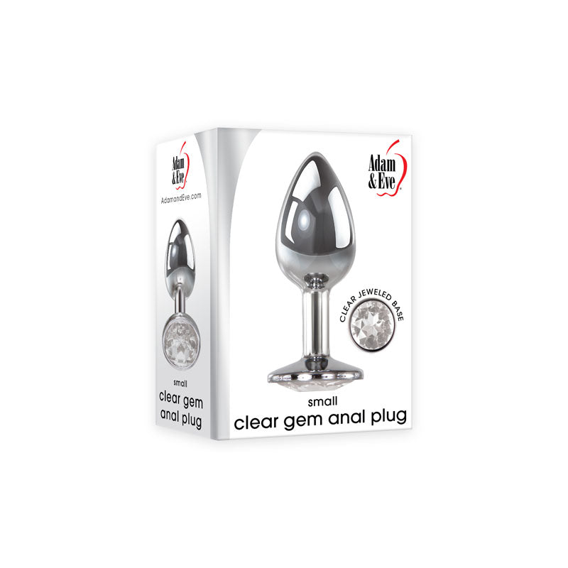 The packaging for the Adam & Eve Clear Gem Anal Plug - Small displays a shiny, silver-colored metal plug with a jeweled base. Made from body-safe, polished aluminum for temperature play fans, the mostly white box features the jewel detail prominently in a circular inset.