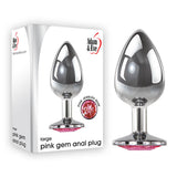 Adjacent to its packaging, the Adam & Eve Pink Gem Anal Plug - Large Silver is eloquently showcased. The box highlights this large-sized metal butt plug with a pink gem, promising an extraordinary sensory experience and perfect for temperature play.