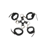 The Adam & Eve Hog Tie - Black Restraints set includes four adjustable black vegan leather wrist cuffs with silver hardware. These cuffs connect at the center with metal rings and leather straps in a symmetrical circular pattern, perfect for enhancing bondage play.