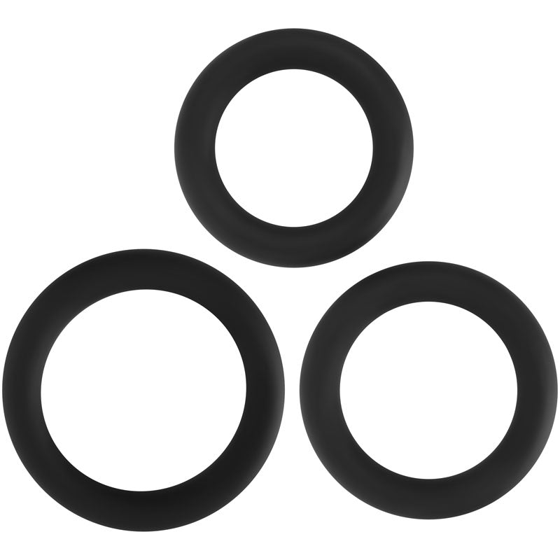 The Adam & Eve Silicone Penis Ring Set, featuring three black cock rings of different sizes, is arranged on a white background. Two smaller rings are side-by-side at the top, while a larger ring is centered below them, forming a triangular design with even spacing and slight overlap.