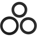 The Adam & Eve Silicone Penis Ring Set, featuring three black cock rings of different sizes, is arranged on a white background. Two smaller rings are side-by-side at the top, while a larger ring is centered below them, forming a triangular design with even spacing and slight overlap.