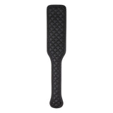 The Adam & Eve Fetish Dreams Beginner Bondage Set includes a black vegan leather paddle with quilted diamond stitching, a narrower handle, and a broad rectangular striking area with rounded edges. Its smooth, polished texture and firm yet flexible design make it ideal for erotic restraint play.