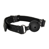 The Adam & Eve Fetish Dreams Advanced Bondage Set includes a black ball gag made from quilted vegan leather with an adjustable strap, metal rivets, and buckles. The sleek polished gag features small holes and is connected by metal rings, enhancing any bondage set.