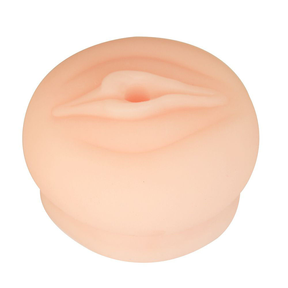 The LuvPump ComFit Universal Pump Sleeve in flesh color is a soft silicone cushion with a central opening, offering optimal comfort and support. Its doughnut-like shape features smooth, rounded edges and a subtly textured surface, ideal for extended pumping sessions.