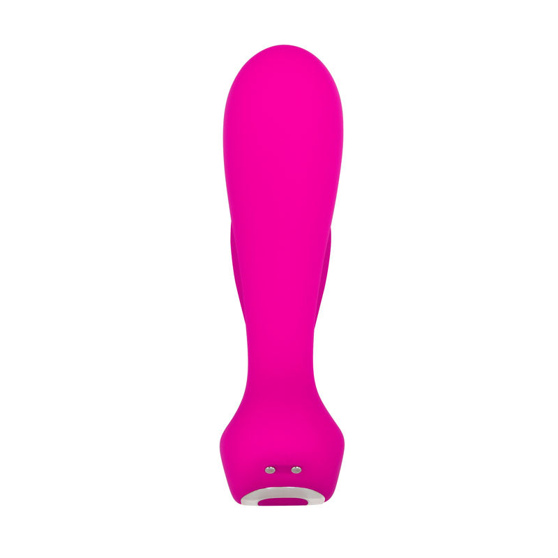 The Adam & Eve Rechargeable Dual Entry Vibe in pink is a USB rechargeable silicone personal massager, featuring an ergonomic design with a smooth, rounded top and slightly wider base. It includes two metallic charging pins at the bottom and a small operational button on the underside.