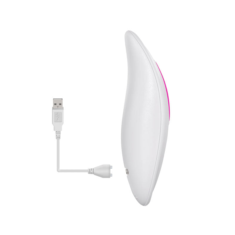 The Adam & Eve Rechargeable Dual Entry Vibe - Pink is a white, curved vibrator with a pink accent, featuring a minimalist and modern design. It stands vertically next to its detachable USB charging cable, which has both standard and small round connectors.