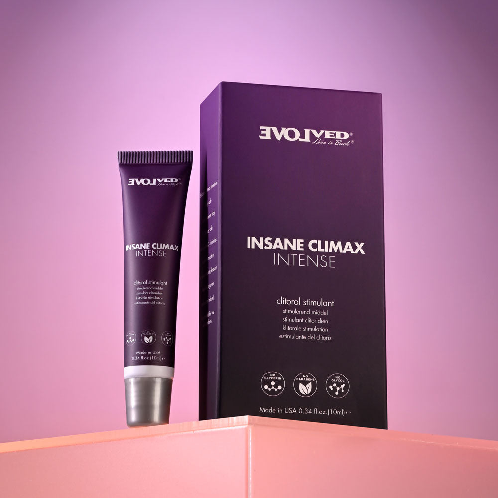 Evolveds INSANE CLIMAX - INTENSE clitoral stimulation gel, packaged in purple with white text, stands out against a pink-purple gradient. The 10 ml tube and matching box have reflective surfaces, promising intimate pleasure with this oil-based topical.