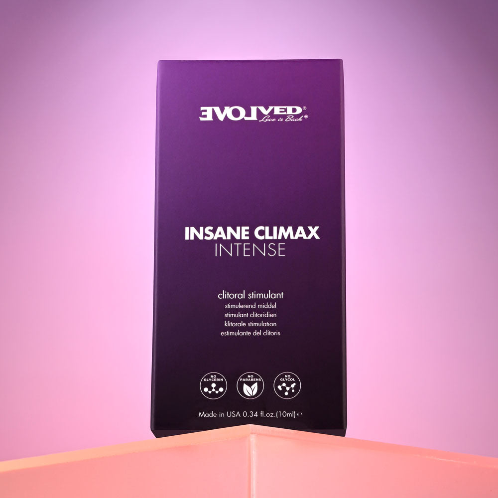 A purple box labeled Evolved INSANE CLIMAX - INTENSE sits against a pink background. This oil-based topical promises amplified pleasure as a clitoral stimulant. Details note Made in USA, with a volume of 0.34 fl oz (10 ml).