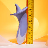 The Evolved LIX & KISSES, a purple 18.7 cm USB rechargeable flicking tongue stimulator, phthalate & latex free, stands upright beside a yellow ruler on a warm yellow background. Featuring a contoured body with curved edges and a tapered top, it measures roughly 6 inches high.