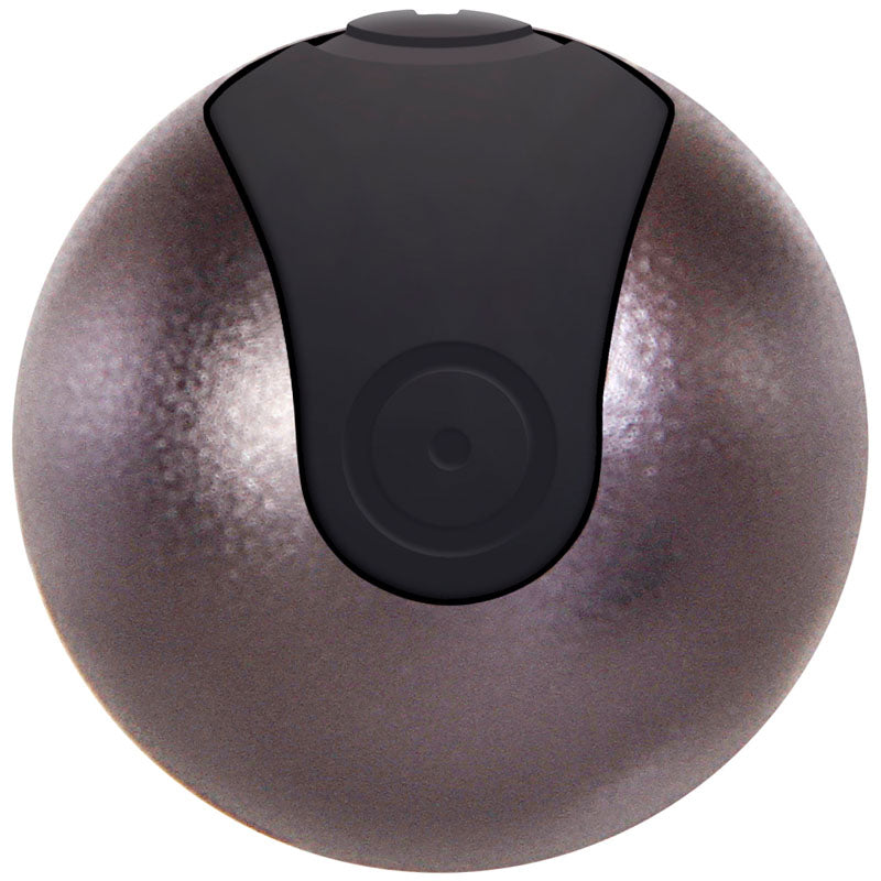 The Evolved Travel-Gasm is a sleek, metallic gray, textured, and spherical 9 cm USB rechargeable bullet with a black top. Its modern design mirrors a futuristic vibrator, while the lighting enhances its reflective sheen. It comes with a travel case for convenience.