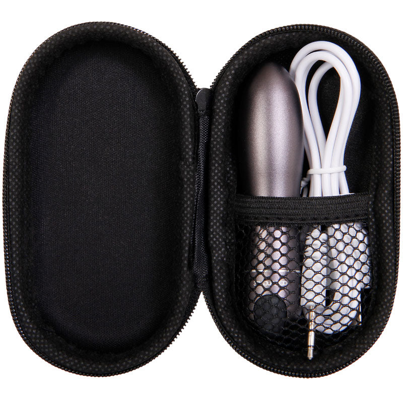 The Evolved Travel-Gasm in metallic gray, a 9 cm USB rechargeable bullet, comes in a black zippered case with an inner mesh pocket. It includes a coiled white cable with a jack plug, offering organized storage for this discreet portable sex toy.