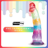 Image of the Jellido 16.5cm Dildo, a phthalate-free transparent PVC dildo with realistic veins featuring a rainbow blend of red, green, yellow, and blue hues. The background has a vibrant gradient with dripping paint highlighting its strong suction cup.