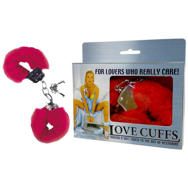 The image shows red fluffy handcuffs called Love Cuffs, next to a box with a suggestive pose. The set includes keys, and the box reads, For lovers who truly care! Adding a soft touch to the art of restraint.