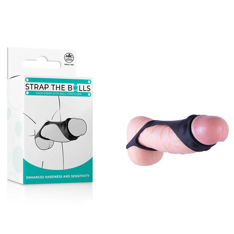 The black silicone Strap The Balls cock strap with ball stretcher is shown next to packaging featuring its name and a graphic of the strap on a flesh-colored model. Made from premium silicone, it enhances hardness and sensitivity for optimal genital use.