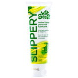 The Wet Stuff Slippery 100g tube is a water-based lubricant offering hypoallergenic comfort and enhanced sensual pleasure. It comes in a predominantly white packaging with green and yellow accents, featuring SLIPPERY vertically and 100 grams at the bottom for easy identification.