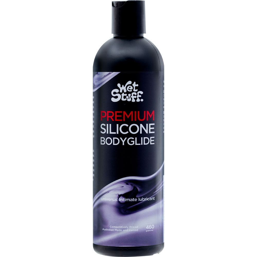 A 460g black Wet Stuff Premium silicone lubricant bottle, ideal for full body massage, features white and red text with a silver swirl design. Labeled as an intimate lubricant and condom compatible, the size is marked as 460 grams.