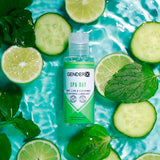 The Gender X SPA DAY Flavoured Lube, a 60 ml water-based lubricant, sits on water with cucumber slices, lime halves, and mint leaves. Its label highlights the mint, lime & cucumber flavor and the vibrant blue hue that enhances its fresh theme for intimate sexual activity.