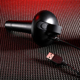 Close-up of the Gender X ECHO - Black 15.3 cm USB Rechargeable Butt Plug on a textured surface with red lighting. The image highlights its sleek design and modern aesthetics, accentuated by dramatic lighting and innovative function for enhanced experience.