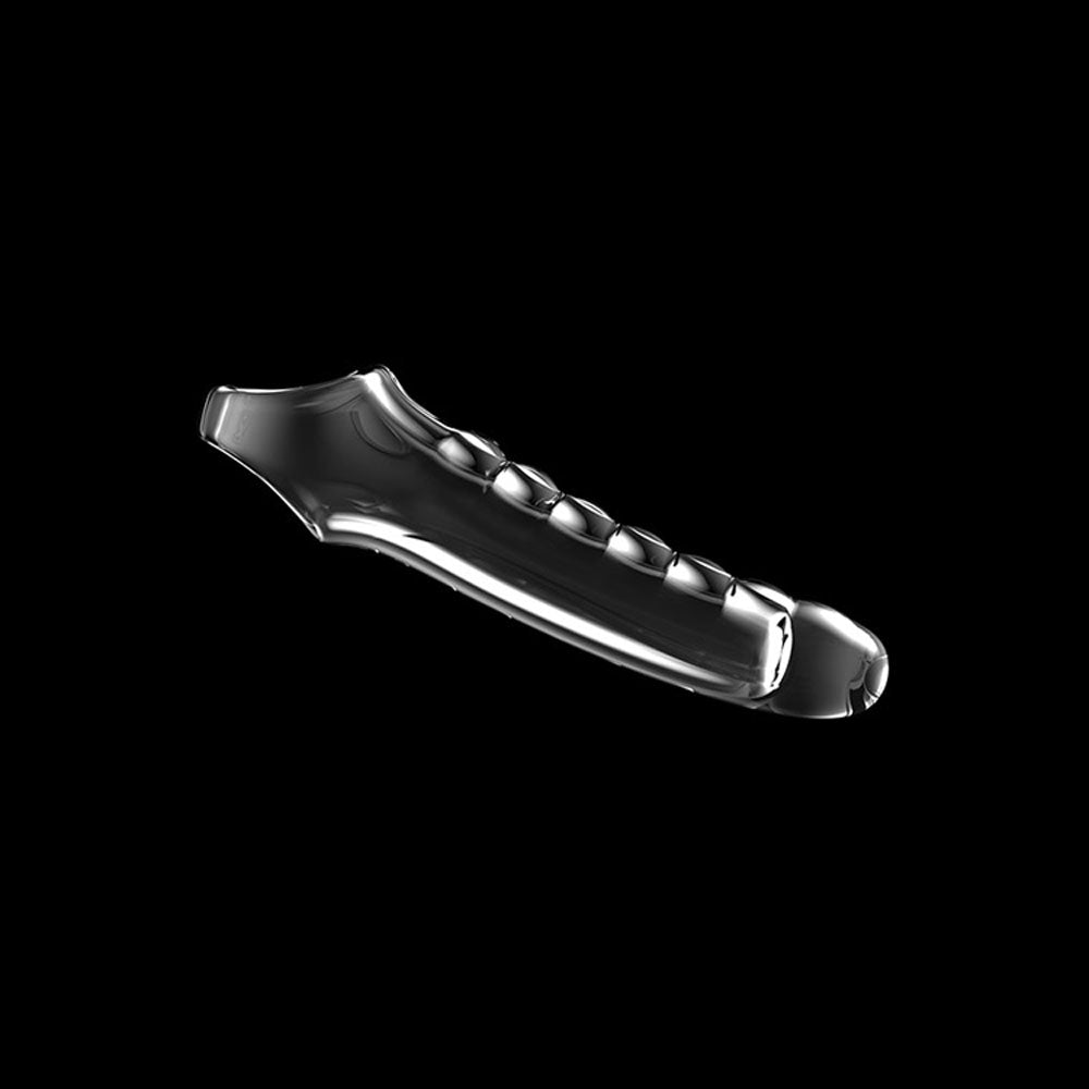 The Adam & Eve Ridged Rider, a sleek clear glass penis extension sleeve (22.9 cm), features six cylindrical protrusions aligned on top. Its reflective surface and ridged texture offer a smooth yet tactile experience, set against a black background.