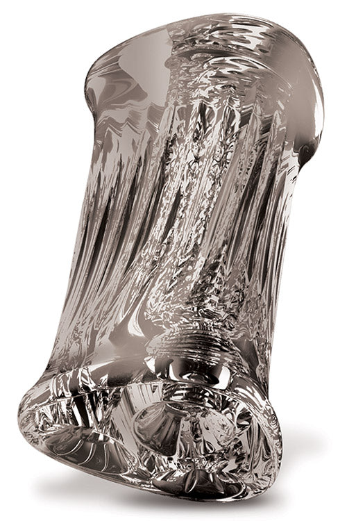 The Adam & Eve Adams 3-Way Stroker is a clear glass sculpture with a glossy finish, featuring intricate swirling patterns resembling flowing liquid. Its three tunnels create varying gray shades, and the easy-grip exterior enhances its dynamic form.