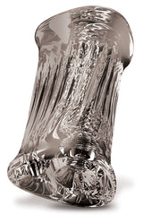 The Adam & Eve Adams 3-Way Stroker - Clear Triple Hole Stroker is a sculpted, translucent glass object with a twisted cylindrical shape and intricate wavy patterns. Its reflective, easy-grip exterior enhances allure as refracted light adds elegance and tactile fascination to its rounded ends.