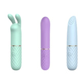 The Adam & Eve TRIPLE PLEASURES set includes three USB rechargeable vibrators: a mint green bunny-eared massager, a lavender wand, and a pale blue G-Spot vibe with a textured tip. Each features a quilted handle with a power symbol.