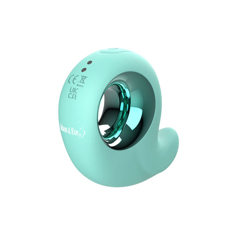 The Adam & Eve CURVY CUTIE PLEASURE COMBO is a teal, donut-shaped vibrator featuring a small tail, metallic inner ring, and branding. Its USB rechargeable and designed for dual stimulation with certification markings, blending sophistication with functionality.