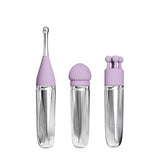 The Adam & Eve SWEET DREAMS MASSAGER KIT includes three chic facial tools with clear handles and lavender tops: a pointed applicator, rounded brush, and triple-ball massager. Their vertical display against a white backdrop enhances their elegant design.