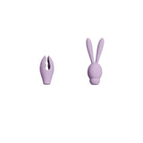 Two lavender Adam & Eve Sweet Dreams Massager Kit attachments appear on a white background. The left features a split, curved design with a textured interior for use with a vibrating base, while the right looks like a bunny, with elongated ears and a smooth finish for clitoral stimulation.