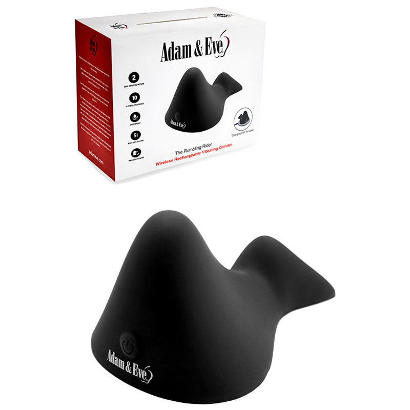 On a white background, the box shows red and white segments with Adam & Eve THE RUMBLING RIDER - Black Rechargeable Vibrating Grinder Pad printed on it. The curved black object has a silicone build with dual motors, a power symbol, and brand name printed on it, presenting a modern look.