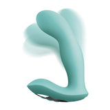 The JimmyJane Pulsus G-Spot is a teal, 15 cm USB rechargeable vibrator with a smooth texture and flexible, arched design for clitoral stimulation. Its wide base provides stability, and it includes a wireless remote. A soft teal shadow background accentuates its contours beautifully.