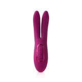 The JimmyJane Solis Ascend 2 PRO, in purple, features a smooth silicone finish and flexible dual tips. It has an oval base with pink accent buttons for easy use and elongated arms for intense stimulation, all set against a white background. Its 16 cm USB rechargeable.