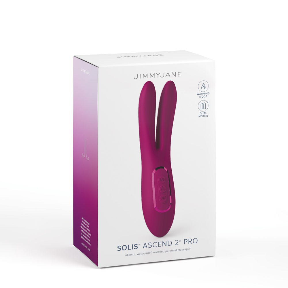 The image shows a white box with a magenta gradient featuring a pink, rabbit-ear-shaped massage device. The brand JIMMYJANE is at the top, and SOLIS® ASCEND 2™ PRO is at the bottom. Smooth silicone icons highlight its waterproof and warming features.