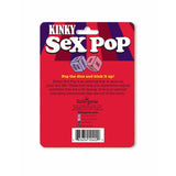 The image shows the back of the Kinky Sex Pop - Popping Dice Game packaging, showcasing it as a fun way to enhance sexual play. It features little genie branding, contact info, and a barcode on a vibrant red and purple background.