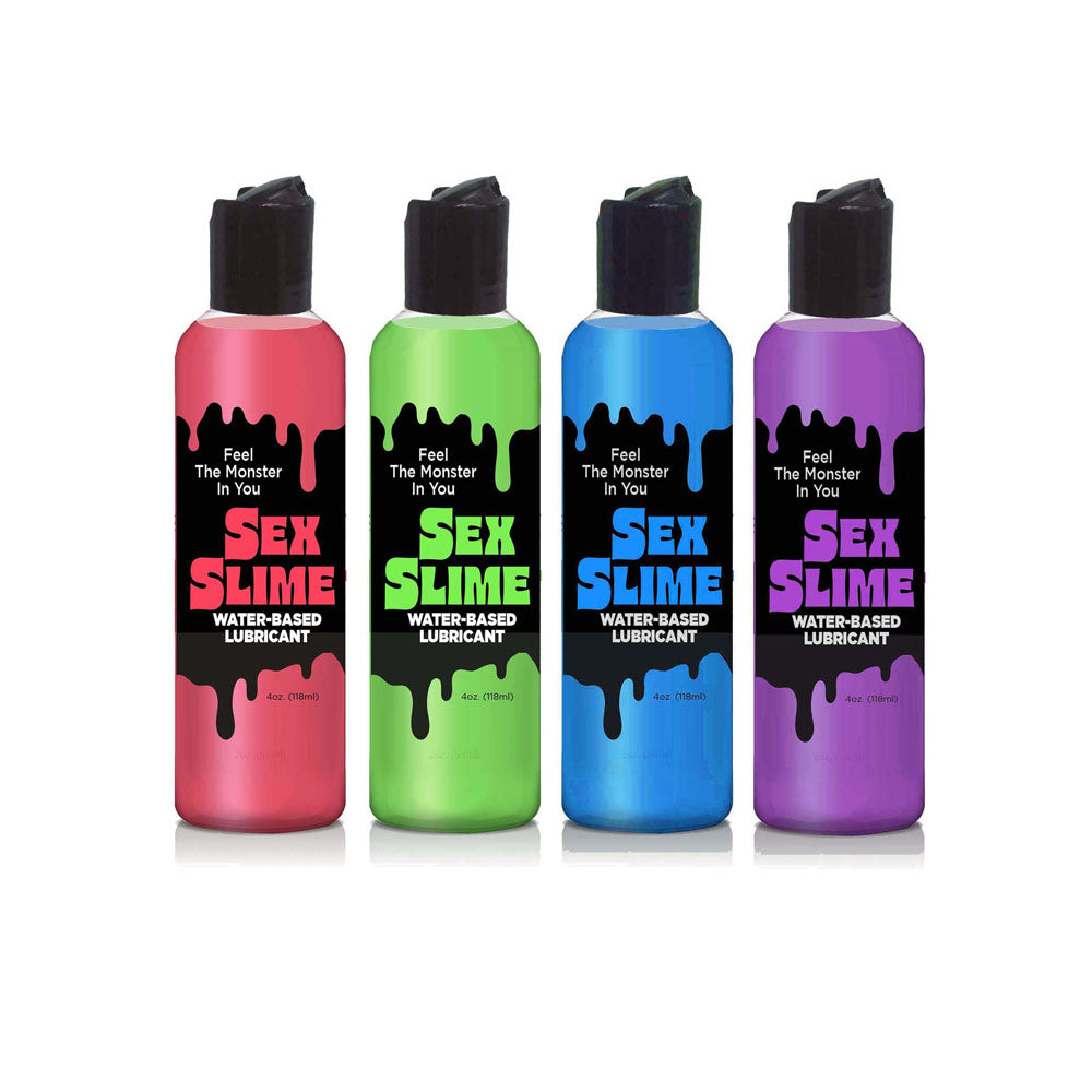 A set of four Sex Slime water-based lubricants is displayed on a white background. The bottles in pink, green, blue, and purple feature a black label with drips and the slogan Feel The Monster In You, promising a smooth body glide experience.