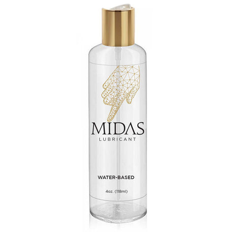 A clear plastic bottle of the gold standard Midas Water Based Lube features a gold cap, with a label showing a geometric hand design pointing down and text: MIDAS Lubricant, WATER-BASED, and 4 oz. (118 ml).