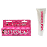 The Booty Cal - Cherry features playful pink packaging with cherries and polka dots, labeled as Cherry Flavoured Anal Numbing Gel for a pleasurable experience, including a matching 44 ml (1.5 oz) tube.