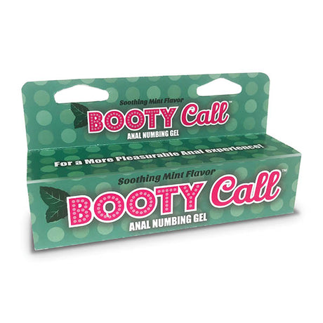 Experience pleasurable anal comfort with Booty Call mint-flavored numbing gel. Packaged in green with polka dots, the product name is highlighted in pink and white, alongside mint leaf illustrations. Available in a 44 ml (1.5 oz) tube.