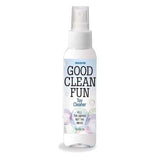 A clear spray bottle labeled Good Clean Fun - Unscented Toy Cleaner, with a white nozzle, features Unscented and Kill the germs, not the mood in black text. Designed for personal pleasure products, it holds 60 ml (2 fl oz) and has bubble graphics to emphasize its germ-busting power.