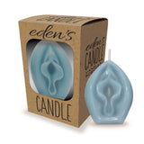 A blue petal-shaped candle sits beside its packaging, a brown box with a clear window displaying the statement piece. Labeled edens Candle Vanilla Scented, this single-wick masterpiece promises to create a soothing ambiance in any space.