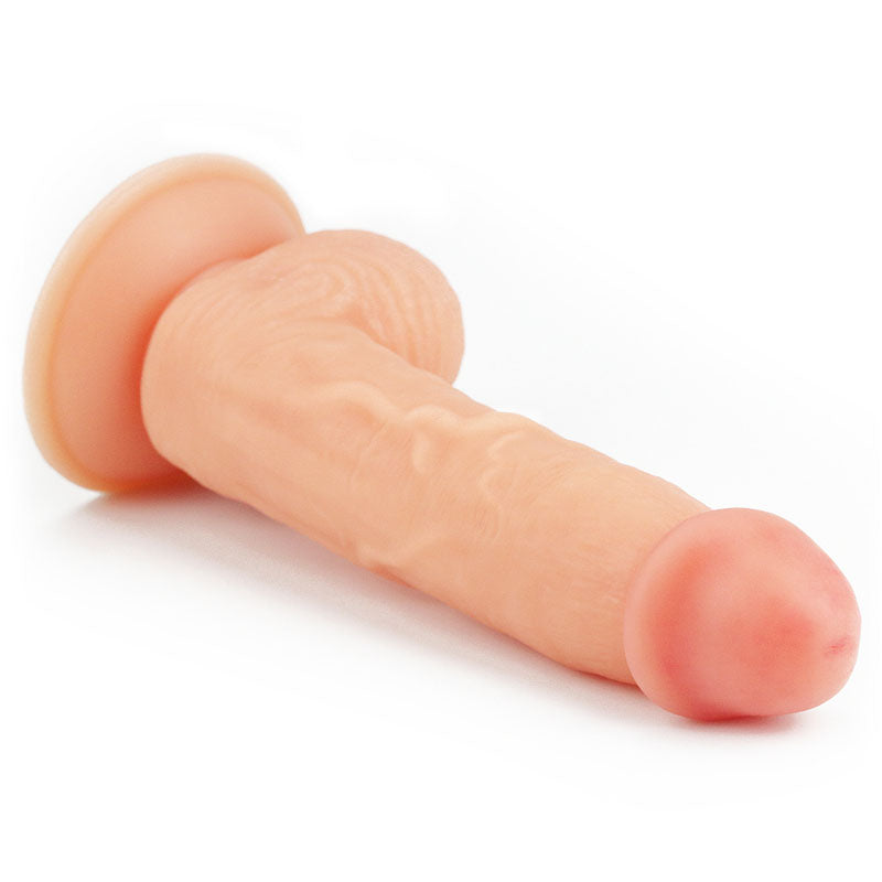 The Ultra Soft Dude - Flesh 20.3 cm (8) Dong is a realistic silicone phallic-shaped object with a suction cup base, featuring detailed veins and a smooth tip for a lifelike appearance. The flesh-toned dildo is positioned horizontally on a white background.