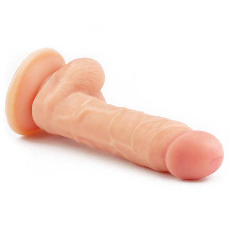 The Ultra Soft Dude - Flesh 20.3 cm (8) Dong showcases a realistic, flesh-toned phallic design with intricate textures and a secure suction cup base, displayed horizontally on a white background.