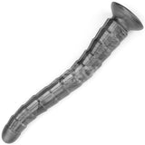 The King Sized Vibrating Vibrax Slider - Grey 36.8 cm is a curved, textured dildo with a flared base, ideal for anal play. Its matte finish and uneven ridges offer a sculpted look. It features 10 vibration functions and stands out against the white background when bathed in light.