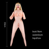 The Victoria Horny Boobie Doll is a lifelike inflatable love doll with long blonde hair, large open mouth, and realistic silicone breasts. Measuring 152 cm in height with a bust of 78 cm, waist of 61 cm, and hips of 87 cm, the doll has semi-raised arms and feet apart for realism against a black background.