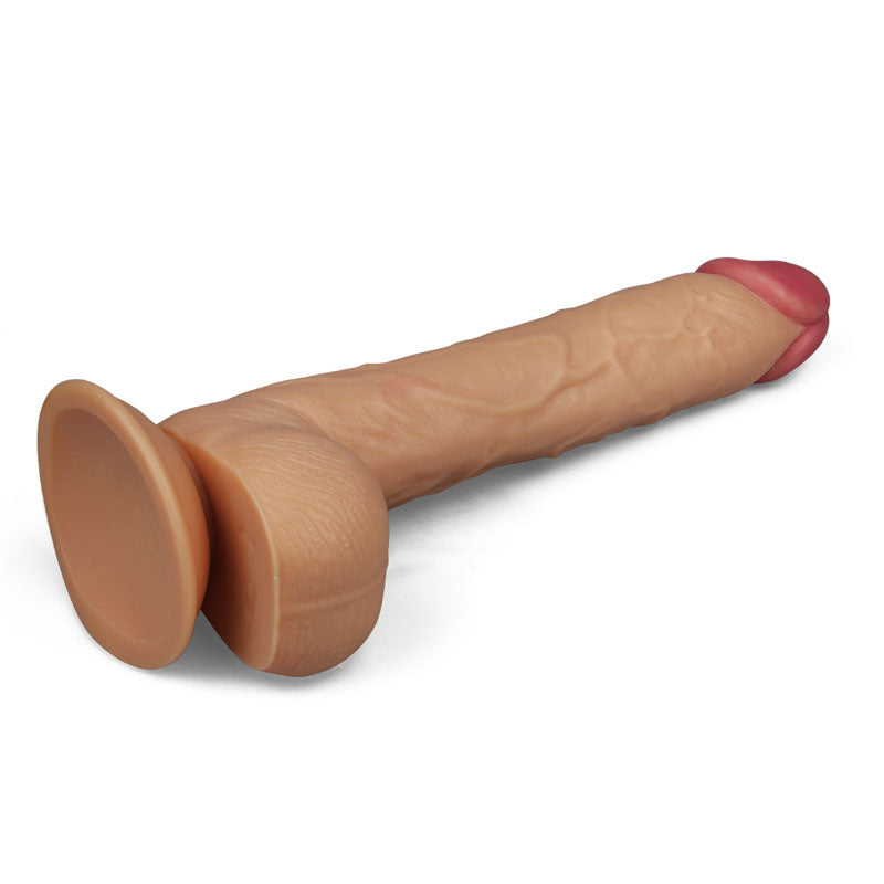 The King Size 10 Realistic Dildo in flesh features a veined texture, darker pink tip, and suction cup base for versatile play. Its perfect for hands-free enjoyment and displayed on a plain white background.