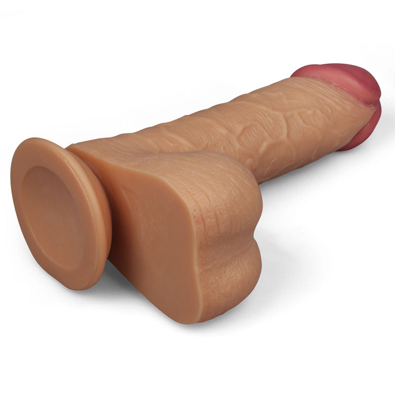 The King Size 9 Realistic Dildo - Flesh 23 cm Dong features a lifelike silicone design with a suction cup base, textured surface, veins, contours, and a reddish tip. It offers a realistic experience and is displayed on a plain white background.