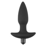 The Anal Indulgence Collection Silicone Fantasy Anal Plug in black features a sleek, smooth surface with an elongated bulbous shape and flared base for safety. A metallic cap at the base reveals its potential as a vibrating massager, offering a minimalist, ergonomic design for those eager to explore new sensations.