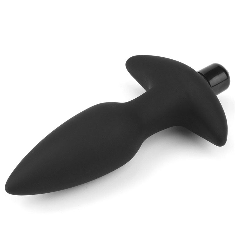 The Anal Indulgence Collection Silicone Fantasy Anal Plug is a 14.5 cm black vibrating butt plug featuring a tapered tip, narrow neck, smooth surface, and flared base with a small button for personal use.