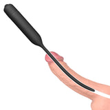 A digital illustration shows the Ultimate Silicone Vibrating Urethral Dilator in black, parallel to a flaccid penis. The design is long and slim with a bullet-shaped handle, intended for deep penetration.